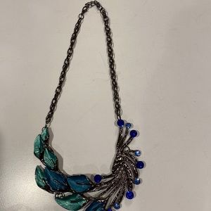 Calla lily design necklace in green/blue.